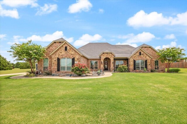 7030 Brooke Blvd, Midlothian, TX 76065 - view of front facade with brick siding, a front lawn, and stone siding