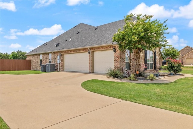 7030 Brooke Blvd, Midlothian, TX 76065 - view of front of property featuring concrete driveway, brick siding, a garage, a shingled roof, and central AC unit