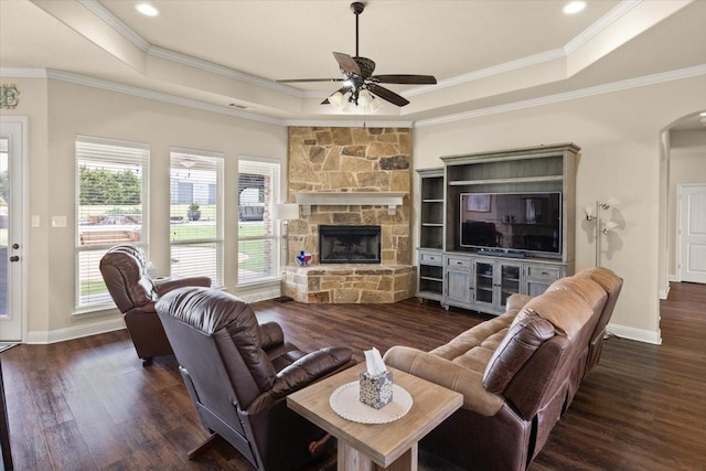 7030 Brooke Blvd, Midlothian, TX 76065 - living room featuring a tray ceiling, a ceiling fan, wood finished floors, and crown molding