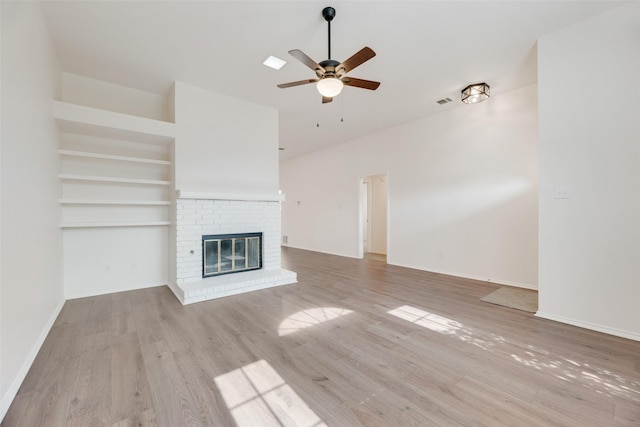 2018 Hearthside Ln, Garland, TX 75044 - unfurnished living room featuring ceiling fan, wood finished floors, a brick fireplace, and baseboards