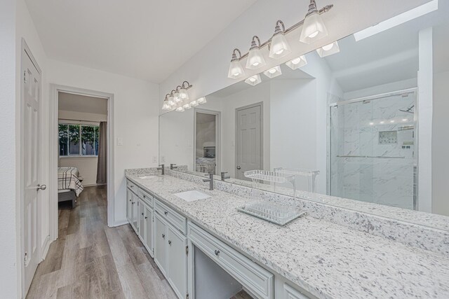 4612 Applewood Rd, Fort Worth, TX 76133 - full bath with connected bathroom, a marble finish shower, double vanity, and wood finished floors