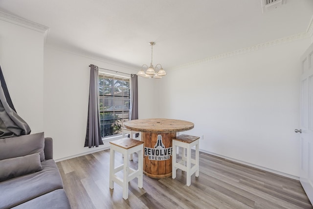 4612 Applewood Rd, Fort Worth, TX 76133 - dining space with a chandelier, light wood-style floors, and ornamental molding