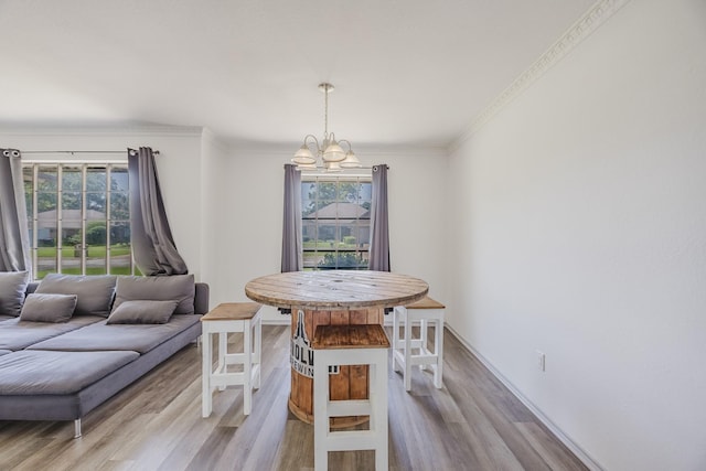 4612 Applewood Rd, Fort Worth, TX 76133 - dining room featuring wood finished floors, a chandelier, crown molding, and baseboards