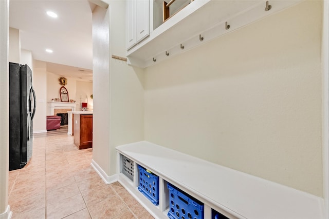11808 Warbler Ln, Fort Worth, TX 76244 - mudroom featuring light tile patterned floors, a fireplace, baseboards, and recessed lighting