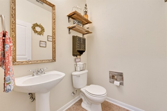 11808 Warbler Ln, Fort Worth, TX 76244 - half bathroom with tile patterned flooring, baseboards, and toilet
