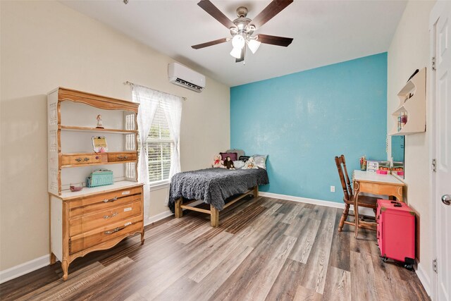 11808 Warbler Ln, Fort Worth, TX 76244 - bedroom with an AC wall unit, wood finished floors, baseboards, and a ceiling fan