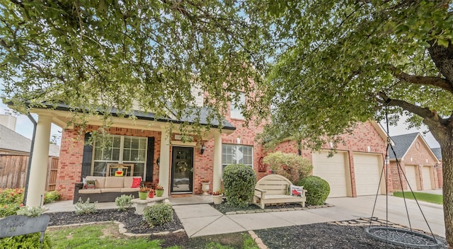 11808 Warbler Ln, Fort Worth, TX 76244 - view of front of property with brick siding, a garage, an outdoor hangout area, and driveway