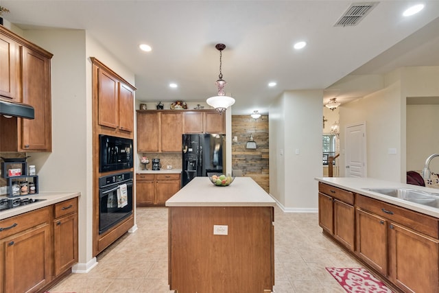 11808 Warbler Ln, Fort Worth, TX 76244 - kitchen with black appliances, a sink, a center island, light tile patterned floors, and recessed lighting