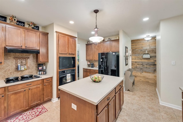 11808 Warbler Ln, Fort Worth, TX 76244 - kitchen featuring black appliances, under cabinet range hood, light tile patterned floors, brown cabinets, and recessed lighting