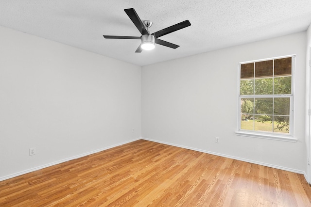 1800 Summer Glen Ct, Allen, TX 75002 - empty room featuring light wood-style floors, baseboards, a ceiling fan, and a textured ceiling