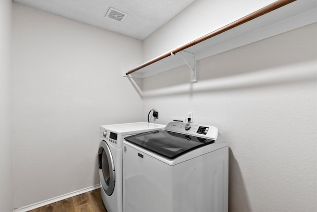 1800 Summer Glen Ct, Allen, TX 75002 - laundry room featuring washing machine and clothes dryer, dark wood-style flooring, and baseboards