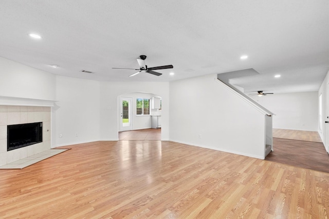 1800 Summer Glen Ct, Allen, TX 75002 - unfurnished living room with a ceiling fan, light wood-type flooring, recessed lighting, and a fireplace