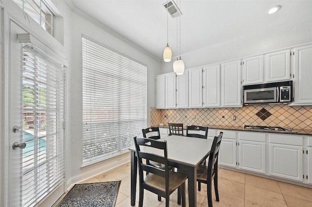 1408 Placer Dr, Allen, TX 75013 - dining room with light tile patterned floors and ornamental molding