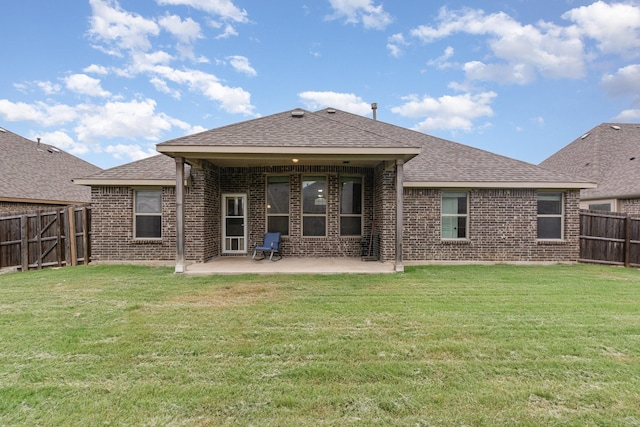 269 Arbury Dr, Forney, TX 75126 - back of house featuring brick siding, a patio, a fenced backyard, and roof with shingles