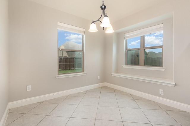 269 Arbury Dr, Forney, TX 75126 - empty room with light tile patterned floors and a chandelier