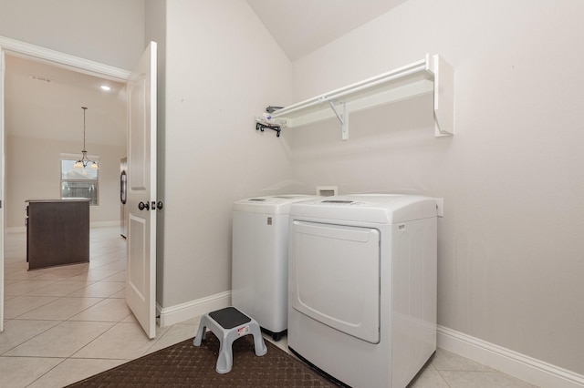 269 Arbury Dr, Forney, TX 75126 - laundry room with washing machine and dryer and light tile patterned flooring