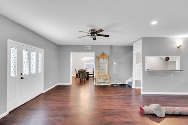 1211 Plateau Dr, Duncanville, TX 75116 - foyer entrance with a ceiling fan, wood finished floors, baseboards, stairway, and a chandelier
