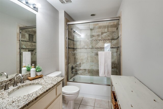 439 Fox Trl, Allen, TX 75002 - bathroom featuring vanity, toilet, enclosed tub / shower combo, and tile patterned flooring