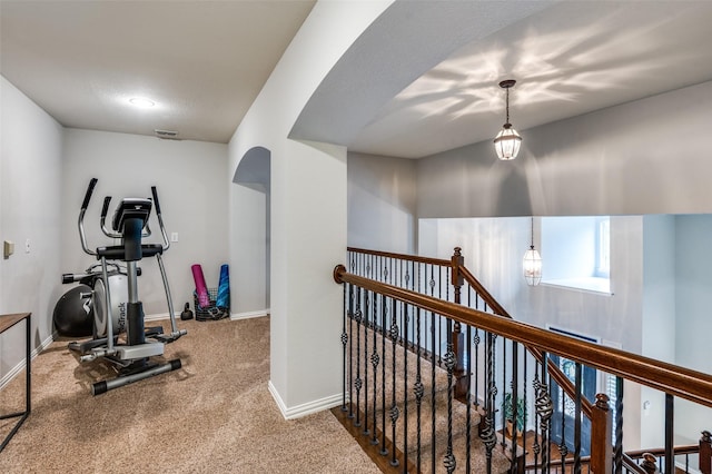 439 Fox Trl, Allen, TX 75002 - exercise room featuring carpet, baseboards, and arched walkways