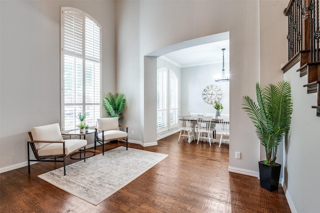 439 Fox Trl, Allen, TX 75002 - living area with crown molding, dark wood-style floors, baseboards, and stairs