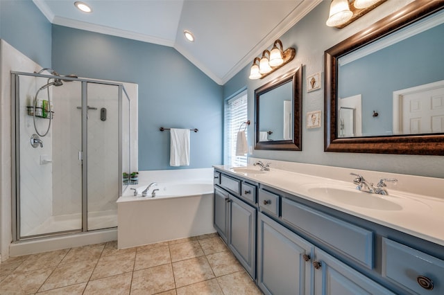 417 Fox Trl, Allen, TX 75002 - bathroom featuring crown molding, lofted ceiling, a bath, double vanity, and a stall shower