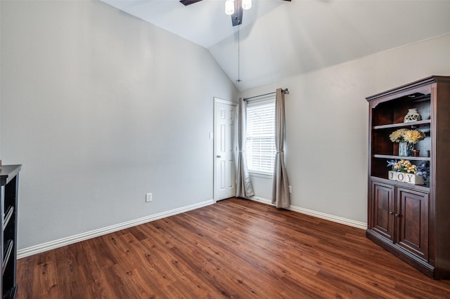 417 Fox Trl, Allen, TX 75002 - empty room with dark wood-type flooring, ceiling fan, baseboards, and lofted ceiling