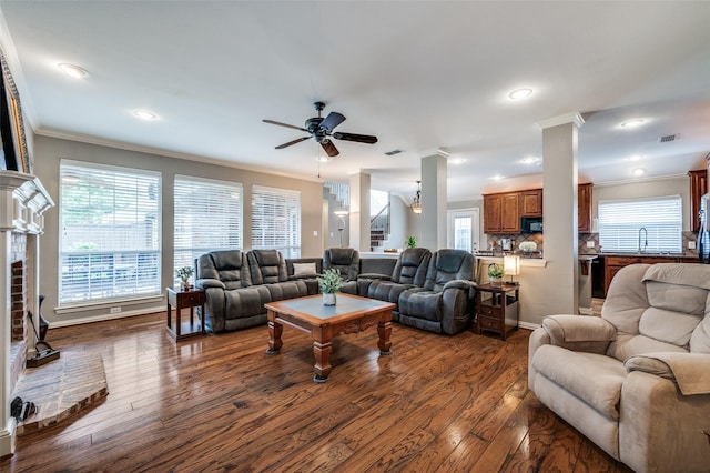 417 Fox Trl, Allen, TX 75002 - living room featuring crown molding, a ceiling fan, dark wood-type flooring, healthy amount of natural light, and recessed lighting