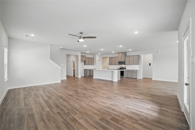 809 Vineyard Way, Forney, TX 75126 - unfurnished living room with recessed lighting, baseboards, wood finished floors, and a ceiling fan