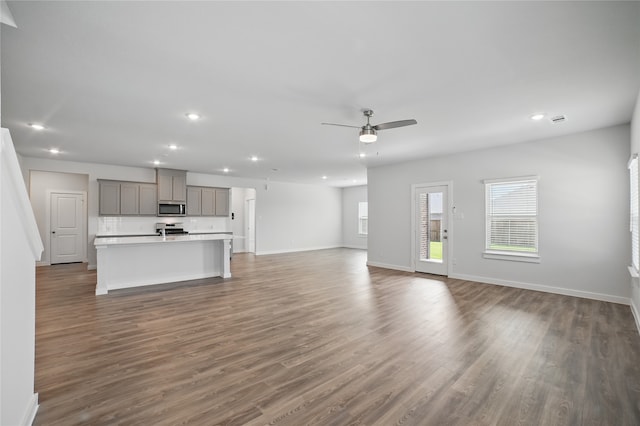809 Vineyard Way, Forney, TX 75126 - unfurnished living room featuring ceiling fan, recessed lighting, dark wood finished floors, and baseboards
