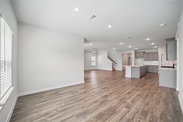 809 Vineyard Way, Forney, TX 75126 - unfurnished living room featuring recessed lighting, a ceiling fan, baseboards, wood finished floors, and stairway
