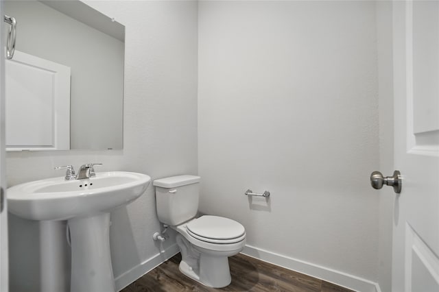 809 Vineyard Way, Forney, TX 75126 - bathroom featuring baseboards, wood finished floors, toilet, and a sink