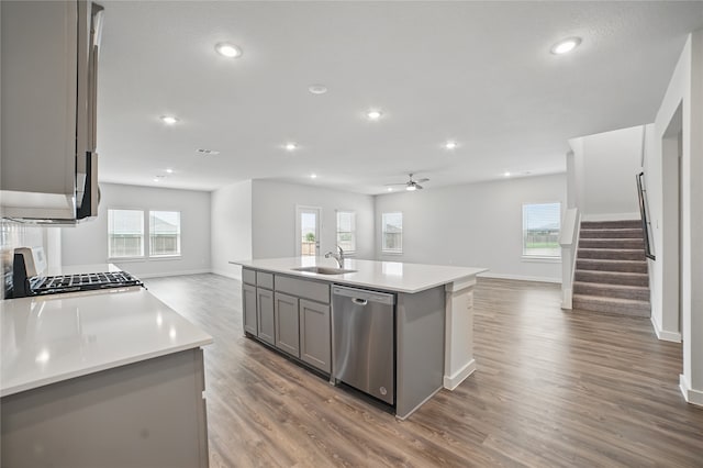 809 Vineyard Way, Forney, TX 75126 - kitchen featuring open floor plan, stainless steel dishwasher, a sink, gray cabinets, and baseboards