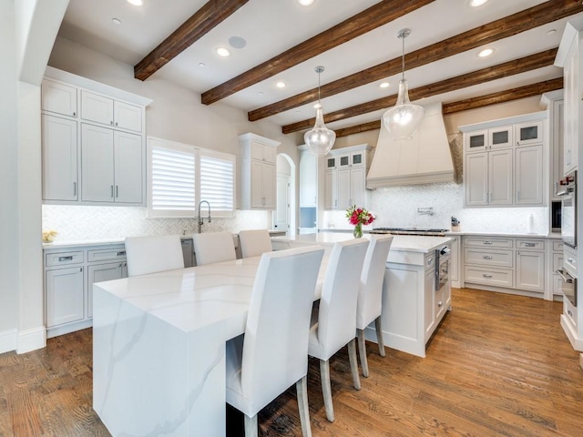 1545 Silver Creek Cir, Lucas, TX 75002 - kitchen with a center island, custom range hood, tasteful backsplash, recessed lighting, and white cabinetry