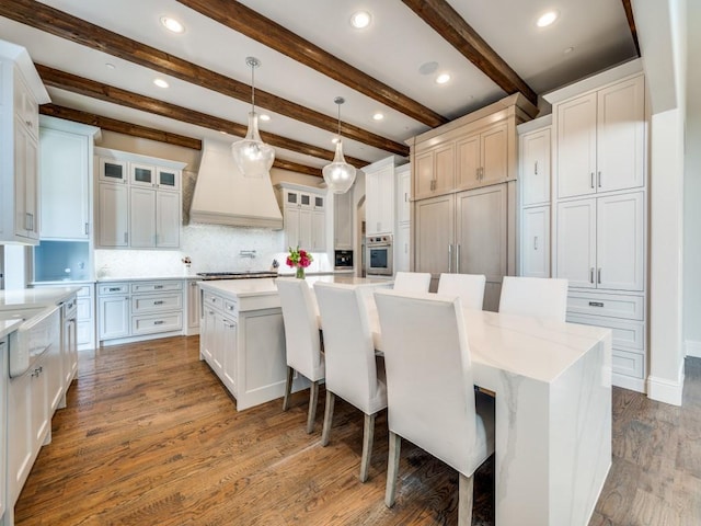 1545 Silver Creek Cir, Lucas, TX 75002 - kitchen featuring oven, custom exhaust hood, a large island, dark wood-style flooring, and backsplash