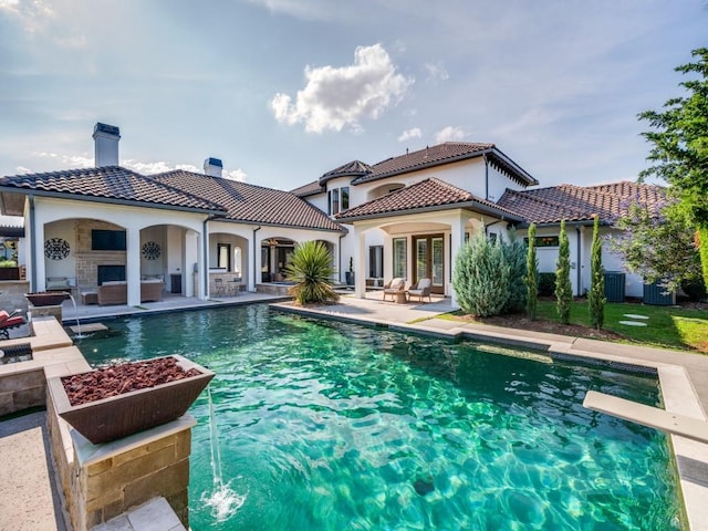 1545 Silver Creek Cir, Lucas, TX 75002 - rear view of property featuring a patio, a chimney, a tiled roof, an outdoor hangout area, and an outdoor pool