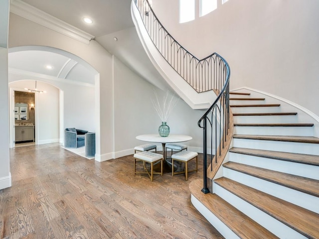 1545 Silver Creek Cir, Lucas, TX 75002 - stairs featuring arched walkways, baseboards, wood finished floors, ornamental molding, and recessed lighting