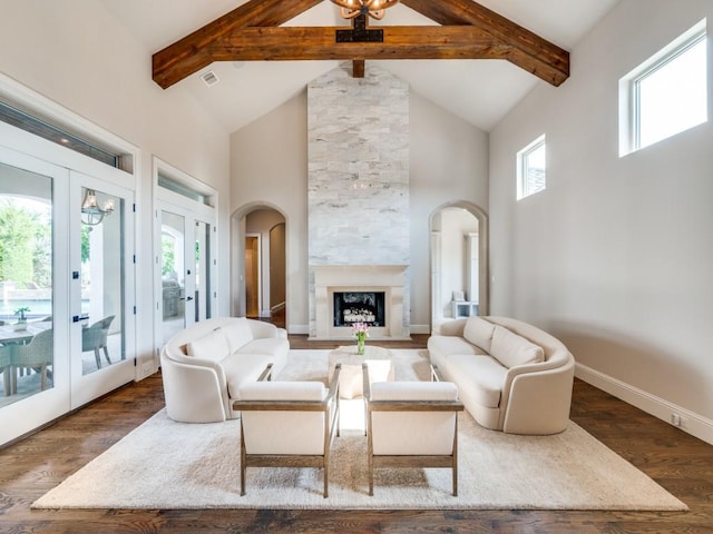 1545 Silver Creek Cir, Lucas, TX 75002 - living area with high vaulted ceiling, beam ceiling, wood finished floors, arched walkways, and french doors