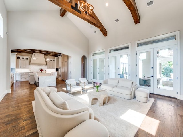 1545 Silver Creek Cir, Lucas, TX 75002 - living area featuring beam ceiling, arched walkways, french doors, high vaulted ceiling, and dark wood-type flooring