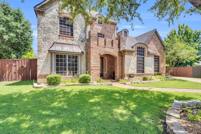 8 Calloway Ct, Mansfield, TX 76063 - french country style house featuring stone siding, brick siding, and a gate