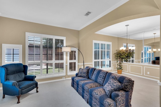8 Calloway Ct, Mansfield, TX 76063 - carpeted living area featuring a chandelier, plenty of natural light, and crown molding