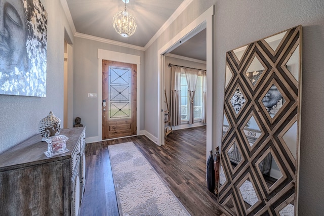 1610 Ryder Lee Ln, Waxahachie, TX 75165 - foyer featuring a chandelier, dark wood-style flooring, ornamental molding, baseboards, and a textured wall