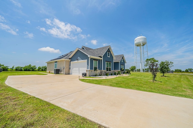 1610 Ryder Lee Ln, Waxahachie, TX 75165 - view of front of house featuring board and batten siding, a front lawn, central AC unit, a garage, and concrete driveway