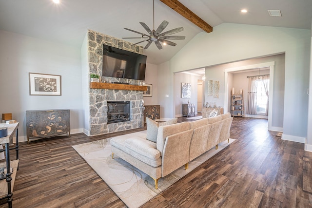1610 Ryder Lee Ln, Waxahachie, TX 75165 - living area with wood finished floors, a ceiling fan, beamed ceiling, a stone fireplace, and baseboards