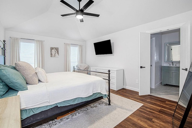 1117 Marcia Ln, Burleson, TX 76028 - bedroom featuring lofted ceiling, dark wood finished floors, baseboards, a ceiling fan, and connected bathroom