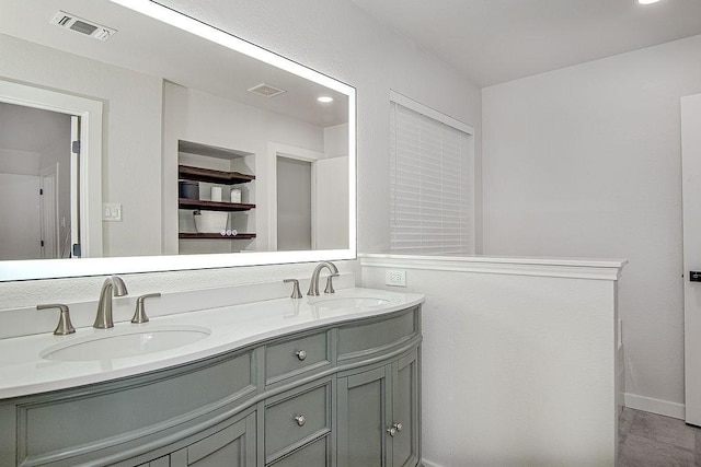 1117 Marcia Ln, Burleson, TX 76028 - full bathroom featuring double vanity and baseboards