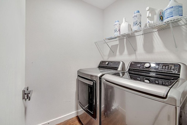 1117 Marcia Ln, Burleson, TX 76028 - laundry area featuring washing machine and dryer, baseboards, and wood finished floors