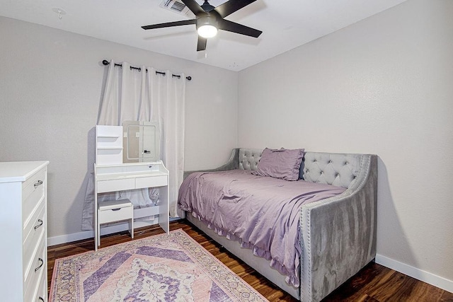 1117 Marcia Ln, Burleson, TX 76028 - bedroom with baseboards, dark wood-style floors, and a ceiling fan