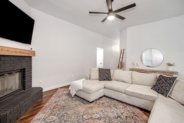 1117 Marcia Ln, Burleson, TX 76028 - living area with a ceiling fan, dark wood-style floors, a fireplace, and baseboards