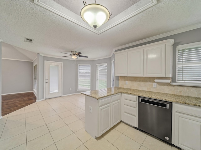 7900 Marsh Ct, Fort Worth, TX 76123 - kitchen featuring stainless steel dishwasher, a textured ceiling, a peninsula, ceiling fan, and white cabinets