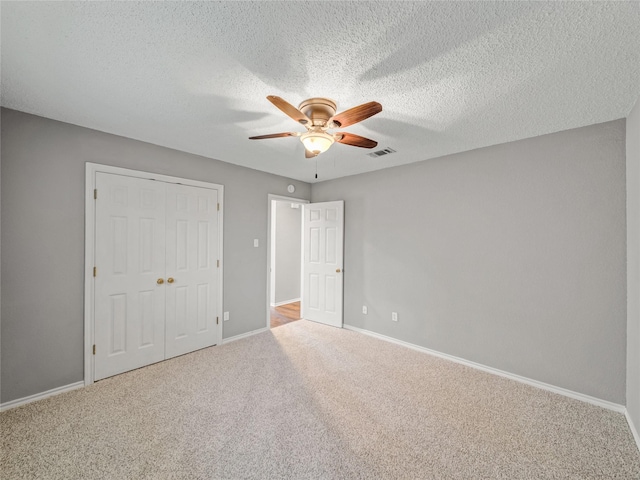 7900 Marsh Ct, Fort Worth, TX 76123 - unfurnished bedroom featuring carpet, baseboards, a closet, a textured ceiling, and ceiling fan
